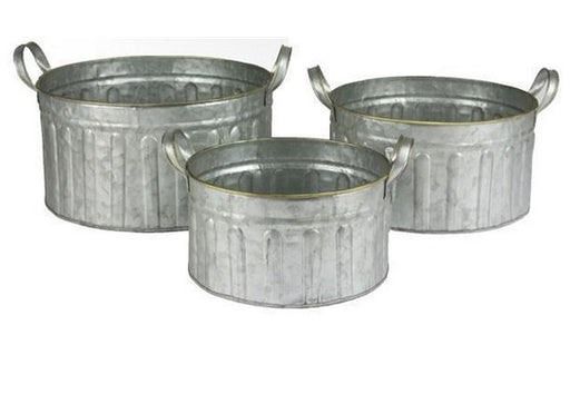 Three galvanized metal buckets of different sizes on a white background