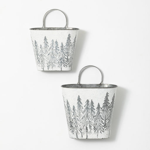 Two metal buckets with forest pattern on a white background
