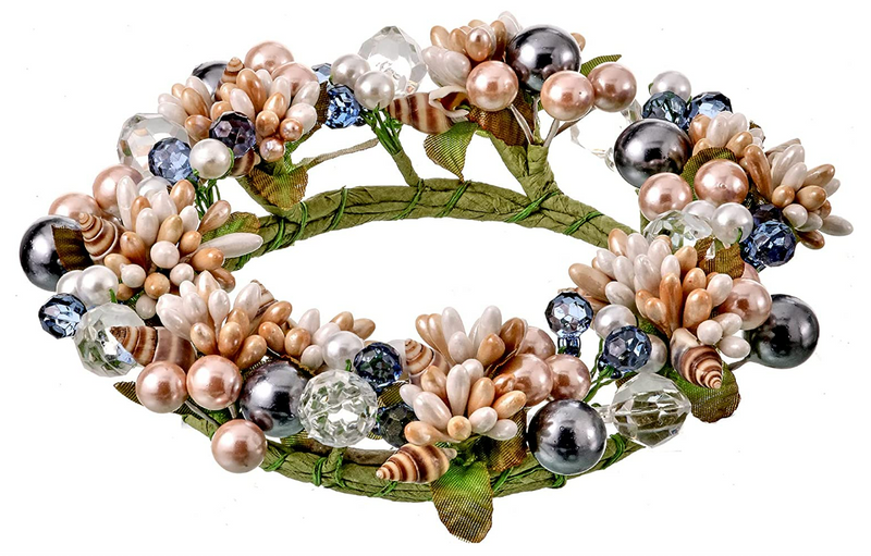 Decorative wreath with pearls, crystals, and greenery on a white background