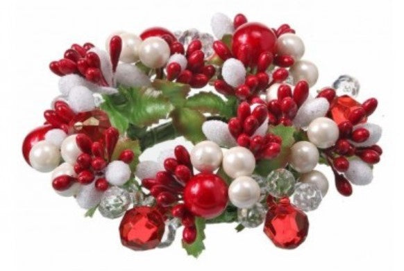 Decorative wreath with red, white, and green beads on a white background