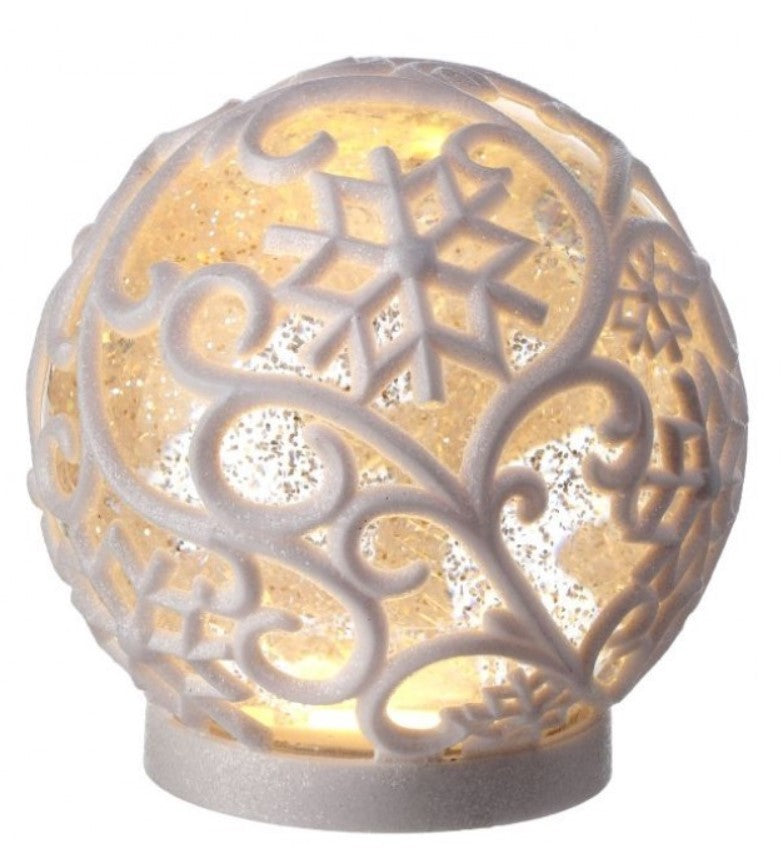 Decorative spherical lamp with intricate patterns on a white background