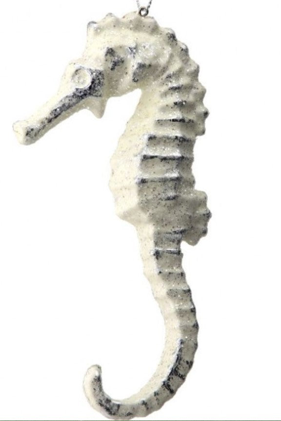 Decorative seahorse figure on a white background