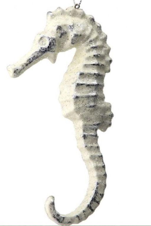 Decorative seahorse figure on a white background