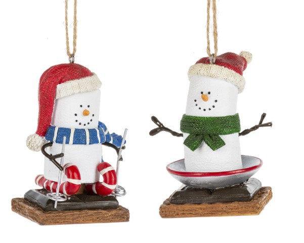 Two snowman ornaments with red hats and scarves on a white background