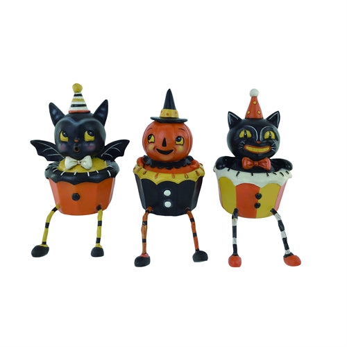 Three Halloween-themed cupcake figurines with bat, pumpkin, and cat designs on a white background.