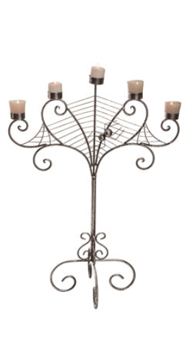 Decorative metal candelabra with candles on a white background