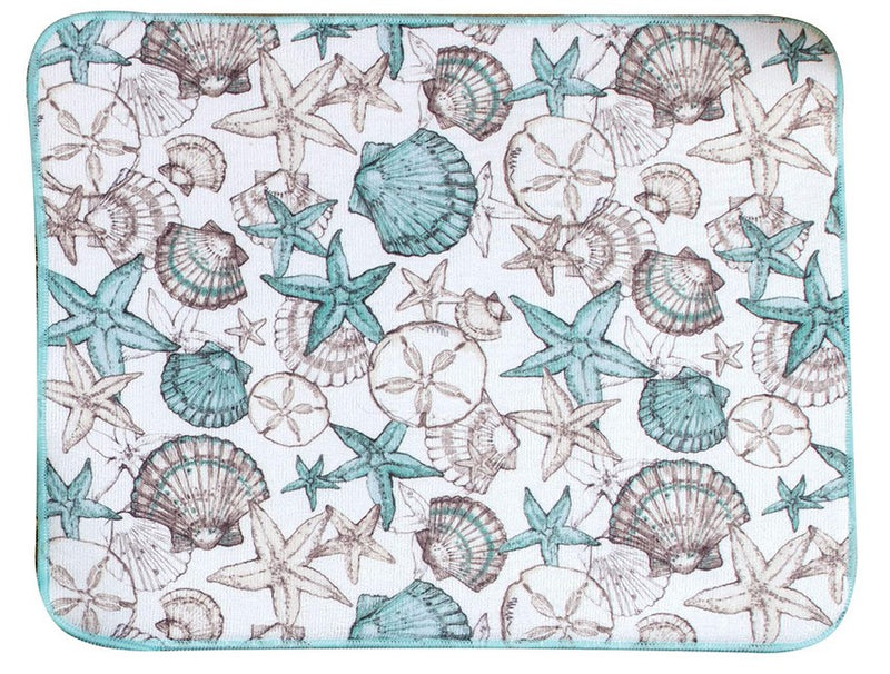 A rectangular countertop drying mat with a nautical pattern featuring sea shells and stars, predominantly in blue and beige colors.