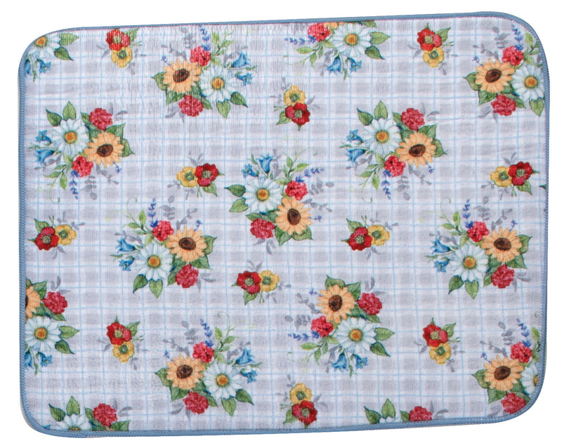 Floral patterned mat with sunflowers and red flowers on a checkered background