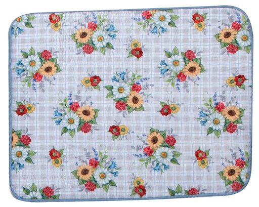Floral patterned mat with sunflowers and red flowers on a checkered background