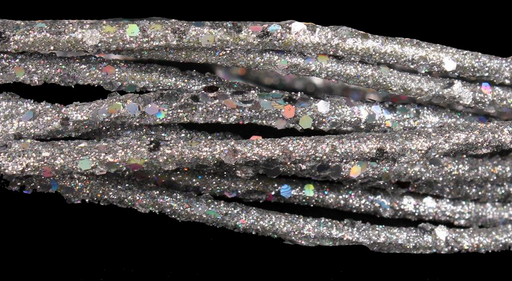 Silver glittery cord on a black background