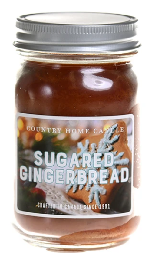Jar of 'Sugared Gingerbread' candle with a decorative label on a white background