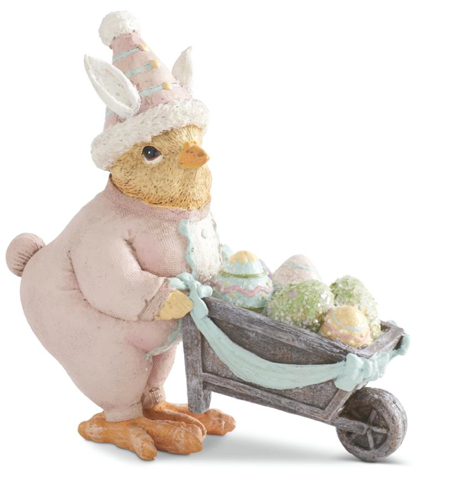 EASTER CHICK IN BUNNY SUIT PUSHING WHEELBARROW FILLED WITH EGGS