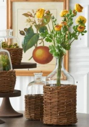 Clear Glass Bottles in Woven Rattan Basket