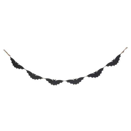 Black bat-shaped decorative item on a white background