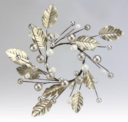 Decorative branch with gold leaves and pearls on a light gray background