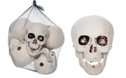 Decorative skull with a mesh bag on a white background