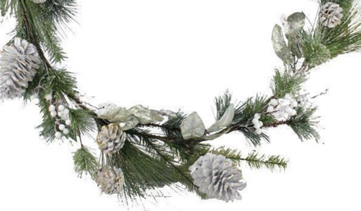 Decorative garland with pine branches and snow-dusted pinecones on a white background