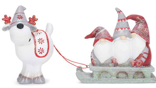Decorative figure of a polar bear pulling a sled with two gnomes, on a white background
