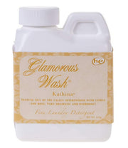 Glamorous Wash laundry detergent bottle with a white label on a white background